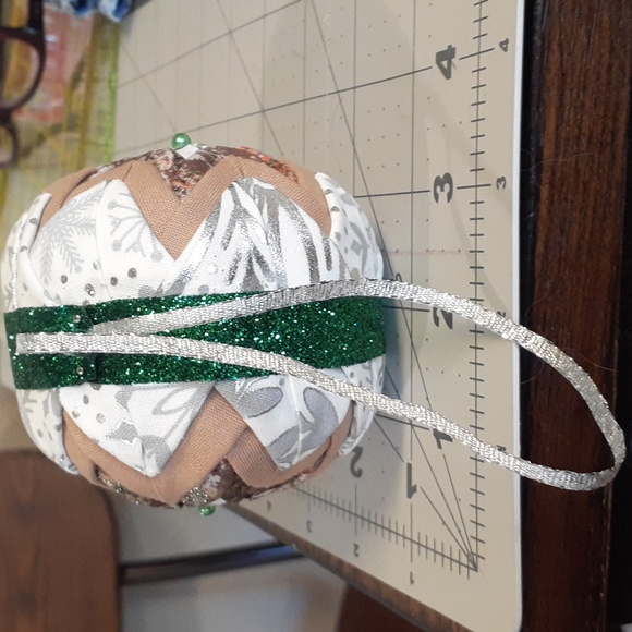 #16 Quilted Christmas Ornament. White, Tan, and Green. Approximately 3.5". - Picture 2 of 3